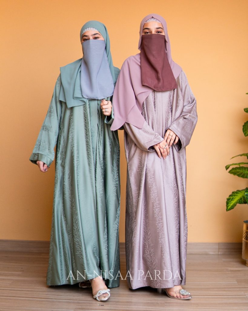 Two models wearing Textured Jacquard Open-Front Gown in light green and silverish pink
